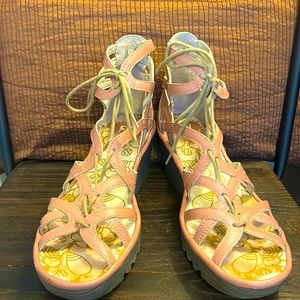 Fly London lace up Yuke wedge sandals.